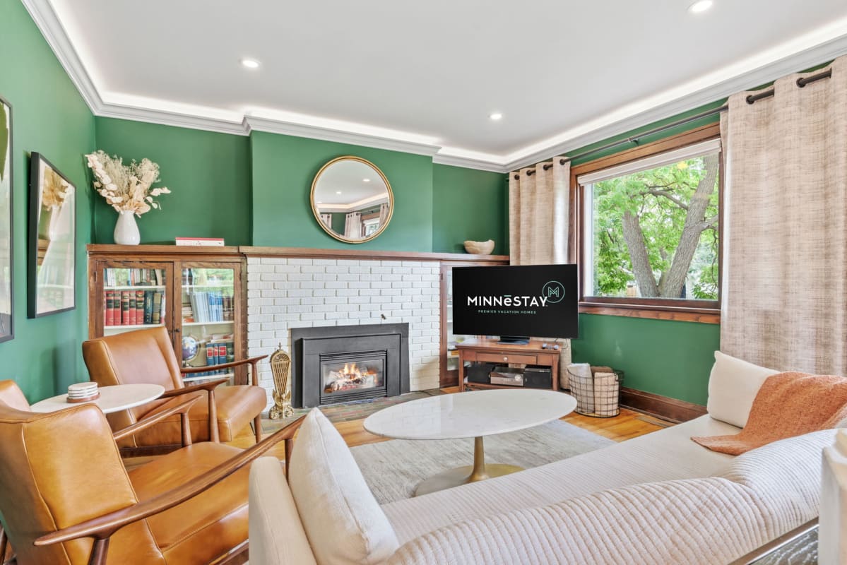 Sink into comfortable seating by your cozy fireplace, where warm leather chairs and soft textures create the perfect retreat.
