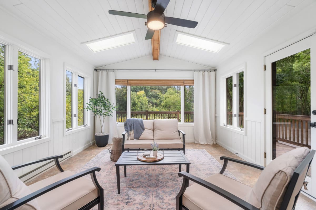 Relax in your bright sunroom with vaulted ceilings and forest views through panoramic windows (primarily usable in late spring, summer and early fall)