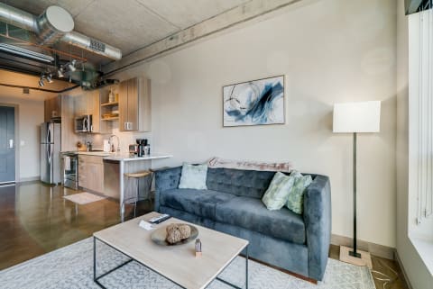 Stylish modern apartment interior featuring a living area and kitchen.