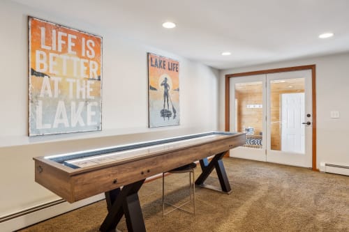Challenge your travel companions to a friendly game on the full-size shuffleboard table, then step through the French doors to continue your lakeside adventure.