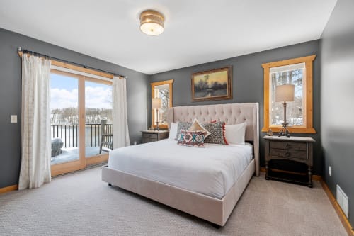 Wake up in your elegantly appointed bedroom with plush bedding and stunning winter views through your private balcony doors.