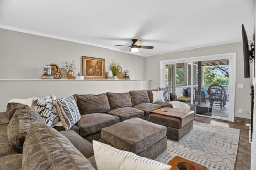 Sink into plush comfort in this inviting living space, where generous seating and thoughtful décor create your perfect retreat for gathering or unwinding after a day of adventure.